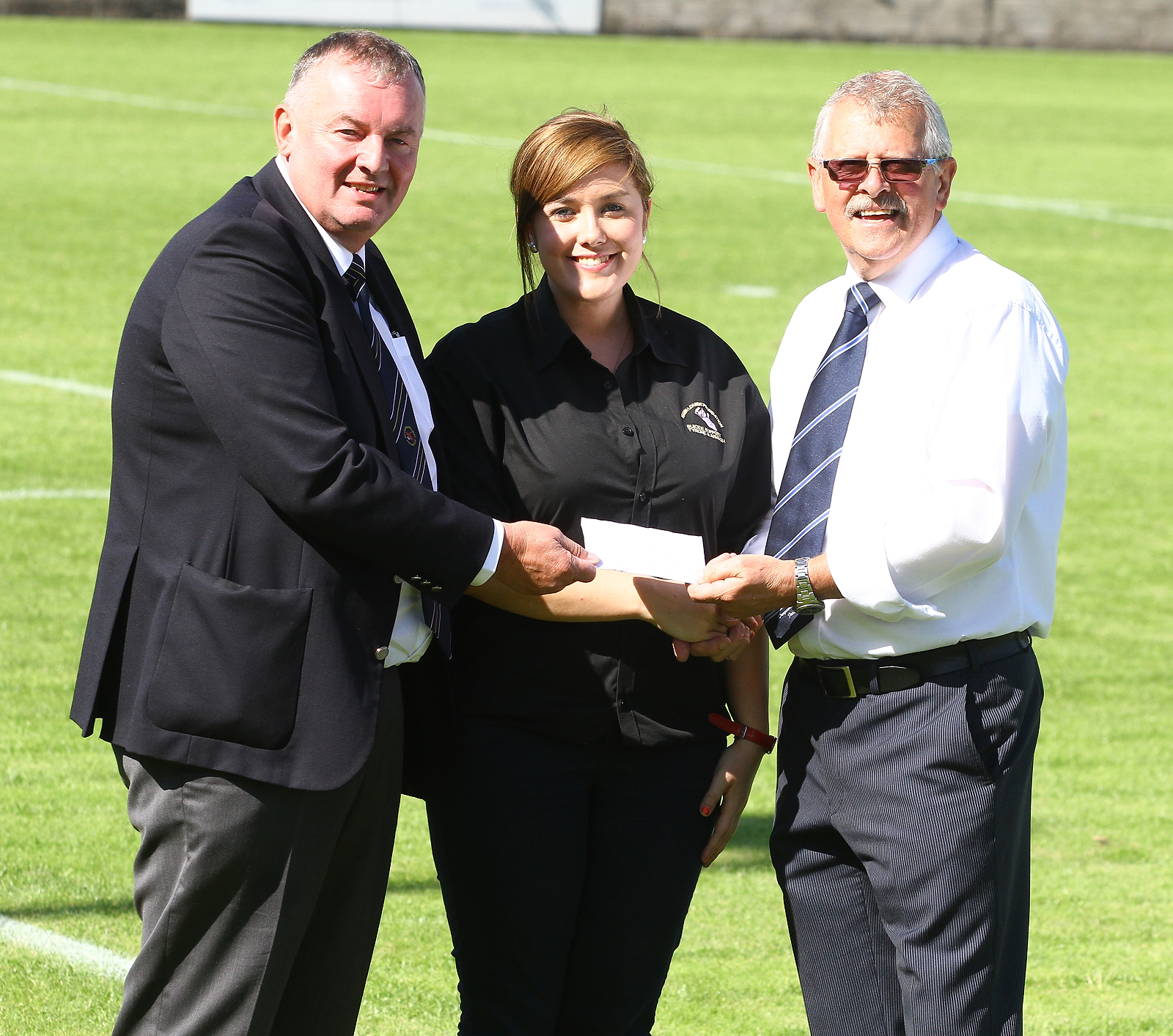 Joe McAree (Dungannon Swifts Community Relations Officer) (right) and Bob Armstrong (Ballinamallard Chairman) (Left) present a donation of £600 to the Niamh Louise Charity at halftime during the Danske Bank Premiership game between the teams. The money was raised at the pre-season Gary Bownes Cup between the teams.